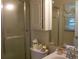 Bathroom featuring a shower with glass doors, mirrored vanity, and medicine cabinet at 2795 Dodson Lee Dr, East Point, GA 30344