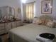 Cozy bedroom with decorative pillows, framed artwork, and dresser with mirror at 2795 Dodson Lee Dr, East Point, GA 30344