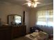 Standard bedroom featuring neutral walls, window with curtain, and ample natural light at 2795 Dodson Lee Dr, East Point, GA 30344