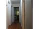 Hallway featuring hardwood floors and white doors offers a welcoming entrance to the home at 2795 Dodson Lee Dr, East Point, GA 30344