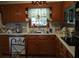 This kitchen offers traditional-style wood cabinets and a white countertop, providing a cozy space for cooking at 2795 Dodson Lee Dr, East Point, GA 30344