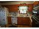 Traditional kitchen features wood cabinets, white countertops, and updated appliances at 2795 Dodson Lee Dr, East Point, GA 30344