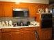 The updated kitchen with wood cabinets, ample counter space, and modern appliances at 2795 Dodson Lee Dr, East Point, GA 30344