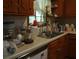 Eat-in kitchen features wood cabinets and drawers with a white countertop and stainless steel sink at 2795 Dodson Lee Dr, East Point, GA 30344