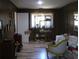 Cozy living room with unique decor, wood paneling, and modern flooring at 2795 Dodson Lee Dr, East Point, GA 30344