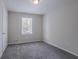Neutral bedroom with carpeted floor, a window with blinds and one door at 3938 Emerald Springs Ct, Decatur, GA 30035