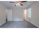 Empty bedroom with neutral walls, carpeted floors, a window, and ceiling fan at 3938 Emerald Springs Ct, Decatur, GA 30035