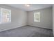 Empty bedroom with neutral walls, carpeted floors, and a window with blinds at 3938 Emerald Springs Ct, Decatur, GA 30035