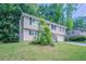 Split level home on a large lot with a large front yard and mature trees at 3938 Emerald Springs Ct, Decatur, GA 30035