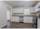 Modern kitchen featuring stainless steel appliances, white cabinets, and granite countertops at 3938 Emerald Springs Ct, Decatur, GA 30035