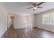 Bright, spacious living room with new flooring and a ceiling fan at 3938 Emerald Springs Ct, Decatur, GA 30035