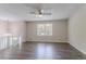 Spacious living room with a ceiling fan and vinyl plank flooring at 3938 Emerald Springs Ct, Decatur, GA 30035
