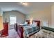 Comfortable bedroom featuring two beds, a window for natural light, and closet space at 609 Turnbill Dr, Mcdonough, GA 30252