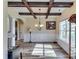 Elegant dining room featuring a coffered ceiling, hardwood floors, and natural light at 609 Turnbill Dr, Mcdonough, GA 30252