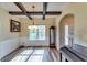 Stylish dining room with hardwood floors, a coffered ceiling, and a classic chandelier at 609 Turnbill Dr, Mcdonough, GA 30252
