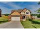 Charming two-story home with a well-manicured lawn and an attached two-car garage at 609 Turnbill Dr, Mcdonough, GA 30252