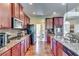 Elegant kitchen features stainless steel appliances and granite countertops at 609 Turnbill Dr, Mcdonough, GA 30252