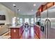 Modern kitchen featuring stainless steel appliances, granite countertops, and a breakfast bar at 609 Turnbill Dr, Mcdonough, GA 30252