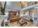 Open-concept living room with hardwood floors, a fireplace, and easy access to the kitchen at 609 Turnbill Dr, Mcdonough, GA 30252