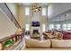 Spacious living room featuring a soaring ceiling, a fireplace, and an open layout at 609 Turnbill Dr, Mcdonough, GA 30252