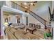 Sun-filled living room with hardwood floors, a staircase, and an open layout at 609 Turnbill Dr, Mcdonough, GA 30252