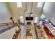 Open-concept living room with high ceilings, fireplace, hardwood floors, and plenty of natural light at 609 Turnbill Dr, Mcdonough, GA 30252