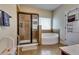 Relaxing bathroom with a large soaking tub and separate shower at 609 Turnbill Dr, Mcdonough, GA 30252