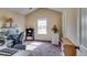 Functional home office with a desk, computer, storage shelves, and natural light from the window at 609 Turnbill Dr, Mcdonough, GA 30252