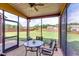 Screened porch with ceiling fan, concrete patio, dining table and chairs, and view of backyard at 609 Turnbill Dr, Mcdonough, GA 30252
