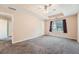 Large bedroom with carpeted floor, ceiling fan, and neutral colored walls at 982 Hunt Rd, Jonesboro, GA 30236