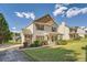 View of a quaint two-story home with well-kept lawn and driveway at 982 Hunt Rd, Jonesboro, GA 30236
