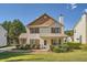 Charming two-story home featuring a well-manicured front lawn and welcoming porch at 982 Hunt Rd, Jonesboro, GA 30236