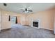Cozy living room featuring a fireplace, neutral walls, and plush carpeting at 982 Hunt Rd, Jonesboro, GA 30236