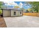 Exterior featuring a light siding, dark trim and a long concrete driveway at 1055 Mayson Turner Nw Rd, Atlanta, GA 30314