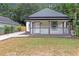 Charming home featuring a cozy front porch and freshly cut lawn at 1055 Mayson Turner Nw Rd, Atlanta, GA 30314