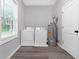 A laundry room with modern washer and dryer and a window providing natural light at 1055 Mayson Turner Nw Rd, Atlanta, GA 30314