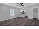 Open living room with sleek dark wood-look floors and a view of the kitchen at 1055 Mayson Turner Nw Rd, Atlanta, GA 30314