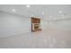 Finished basement featuring tile floors, a fireplace with red brick accent, and recessed lighting at 1864 Gloucester Ct, Snellville, GA 30078