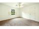 Standard bedroom with white walls, carpet and natural light from a window at 1864 Gloucester Ct, Snellville, GA 30078