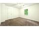 Standard bedroom with carpet, ceiling fan and natural light from a window at 1864 Gloucester Ct, Snellville, GA 30078