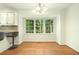 Cozy breakfast nook with bright windows overlooking a green yard at 1864 Gloucester Ct, Snellville, GA 30078