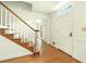Bright entryway featuring hardwood floors, staircase, and white trim and a door with sidelight windows at 1864 Gloucester Ct, Snellville, GA 30078