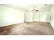 Large living room featuring neutral carpet and bright white walls at 1864 Gloucester Ct, Snellville, GA 30078