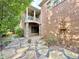 This backyard has a stone path and landscaping and plants at 2080 Village Station Xing, Smyrna, GA 30080