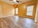 Bright bedroom featuring hard wood floors, ceiling fan, and two windows at 2080 Village Station Xing, Smyrna, GA 30080
