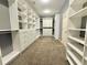 Large walk-in closet with extensive shelving, drawers, and rod space for organized storage at 2080 Village Station Xing, Smyrna, GA 30080