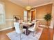 Elegant dining room featuring hardwood floors, decorative lighting, and a well-appointed table setting at 2080 Village Station Xing, Smyrna, GA 30080