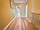 Long hallway with hardwood floors and neutral paint at 2080 Village Station Xing, Smyrna, GA 30080
