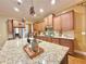Open kitchen featuring granite countertops, stainless appliances, and pendant lighting at 2080 Village Station Xing, Smyrna, GA 30080