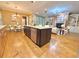 Kitchen island features stainless appliances and opens to the living room with fireplace at 2080 Village Station Xing, Smyrna, GA 30080